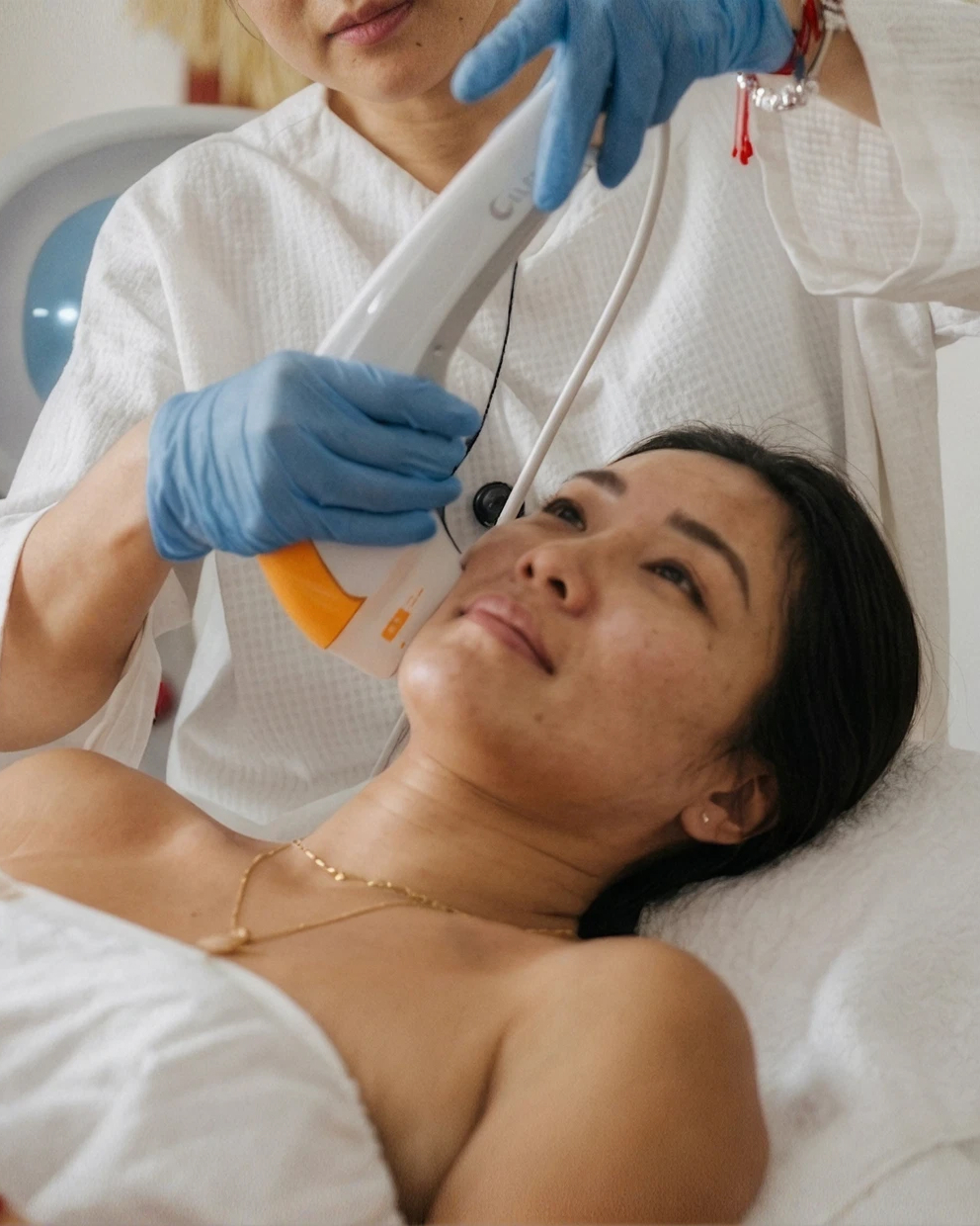 Ultraformer MPT HIFU handpiece treating a patient's jawline